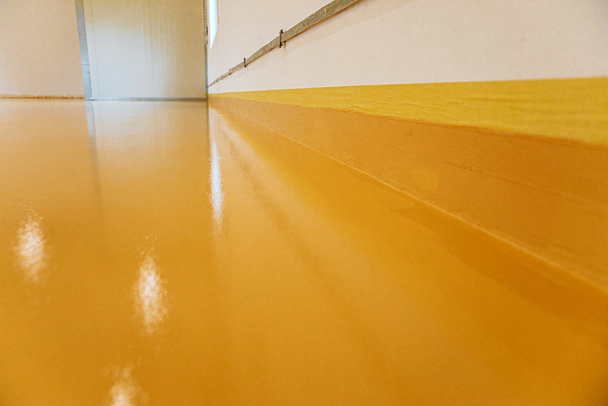 New epoxy floor in warehouse factory. Construction series